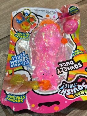 JA-RU Irre-Squish-tible! Sqweezy Duck Stretch Toy - Pink Glitter